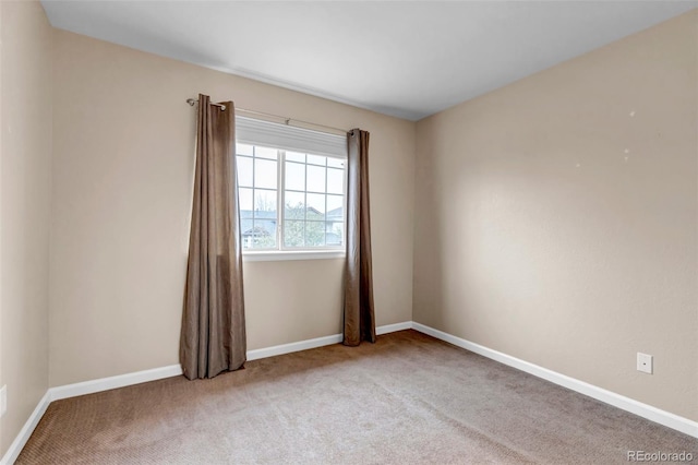 12047 W Coal Mine Dr, Littleton, CO 80127 - spare room with carpet flooring and baseboards