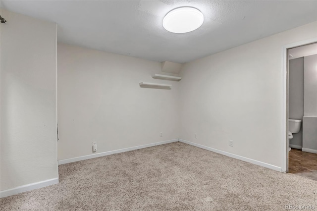 12047 W Coal Mine Dr, Littleton, CO 80127 - carpeted empty room with baseboards