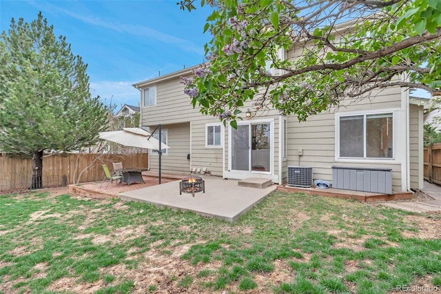 12047 W Coal Mine Dr, Littleton, CO 80127 - back of house featuring a lawn, an outdoor fire pit, a patio, and a fenced backyard