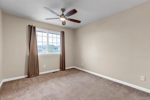 12047 W Coal Mine Dr, Littleton, CO 80127 - spare room featuring baseboards, carpet flooring, visible vents, and a ceiling fan