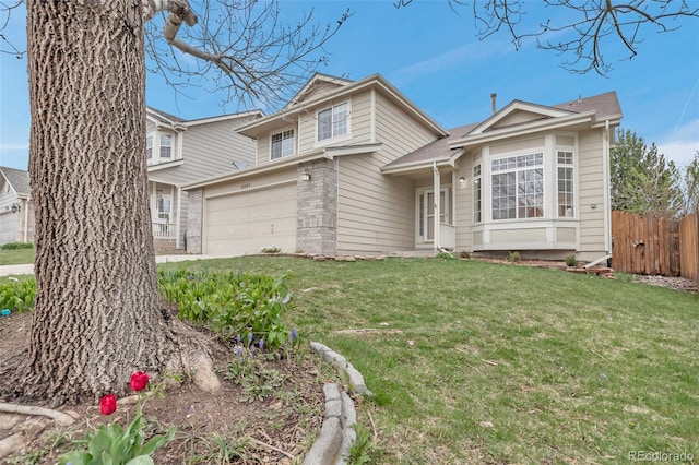 12047 W Coal Mine Dr, Littleton, CO 80127 - view of front of property with fence, a garage, brick siding, and a front yard