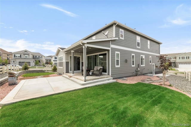 27986 E Frost Pl, Aurora, CO 80016 - back of house with a lawn and a patio area