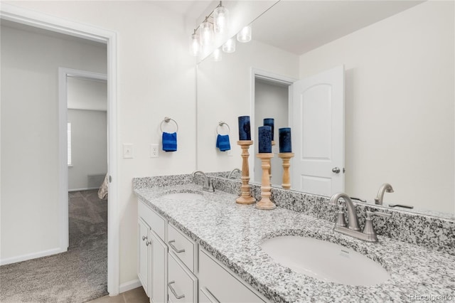 27986 E Frost Pl, Aurora, CO 80016 - bathroom with double vanity and baseboards