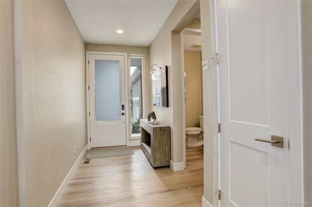 11142 Bright Sky St, Littleton, CO 80125 - entryway with light wood finished floors, baseboards, and recessed lighting