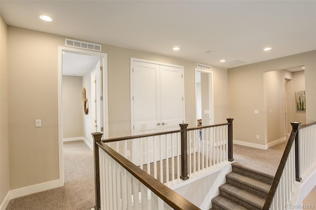 11142 Bright Sky St, Littleton, CO 80125 - corridor featuring light colored carpet, an upstairs landing, baseboards, and recessed lighting