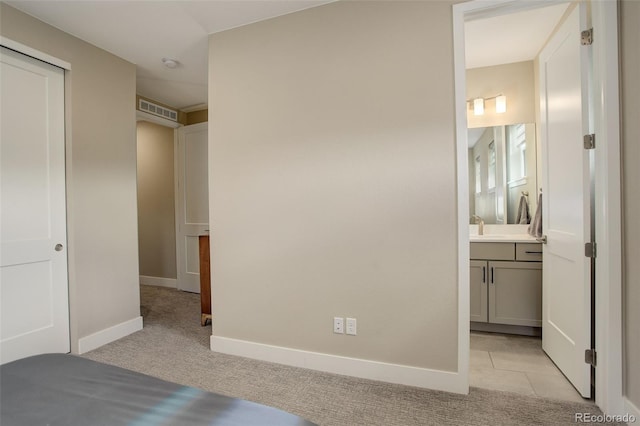 11142 Bright Sky St, Littleton, CO 80125 - unfurnished bedroom featuring baseboards, light carpet, and ensuite bath