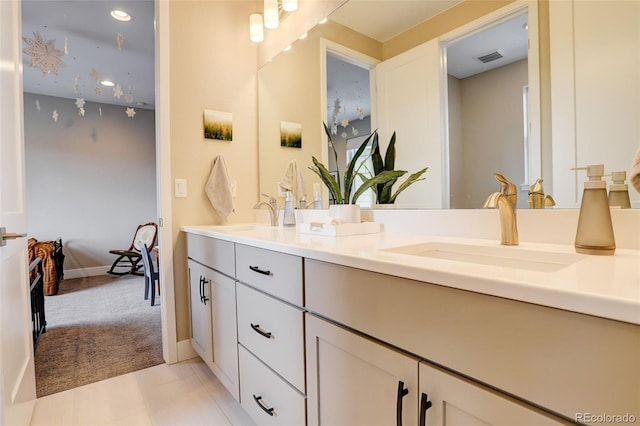 11142 Bright Sky St, Littleton, CO 80125 - bathroom with double vanity, recessed lighting, baseboards, and tile patterned floors