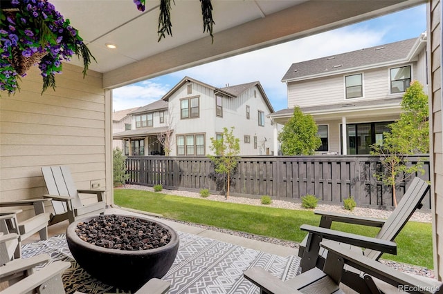 11142 Bright Sky St, Littleton, CO 80125 - view of patio / terrace with a fire pit and a residential view