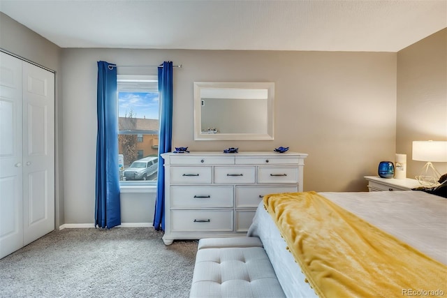 bedroom with light colored carpet and a closet