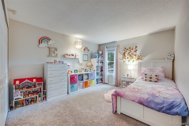 carpeted bedroom featuring a textured ceiling