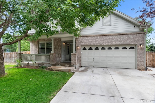 7171 Canyon Way, Frederick, CO 80504 - view of front of property featuring covered porch, brick siding, driveway, and an attached garage