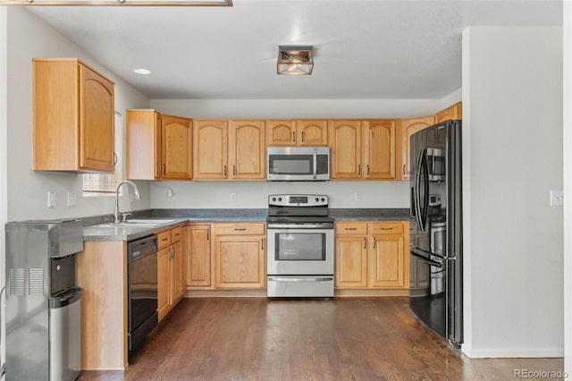 7171 Canyon Way, Frederick, CO 80504 - kitchen featuring black appliances, light brown cabinetry, and dark wood-style floors