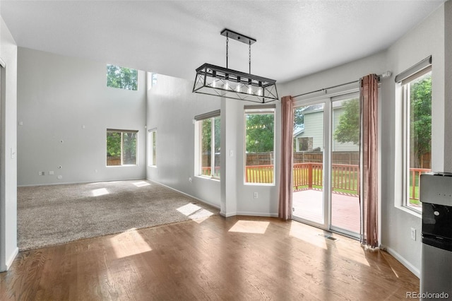 7171 Canyon Way, Frederick, CO 80504 - unfurnished dining area with plenty of natural light and wood finished floors