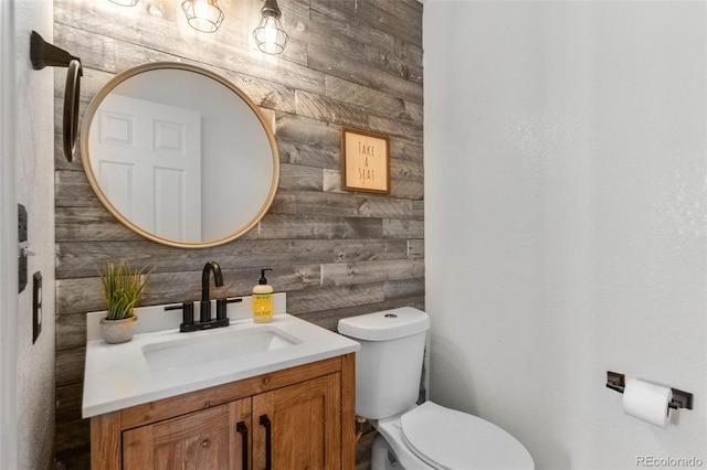 7171 Canyon Way, Frederick, CO 80504 - half bath with vanity and wood walls