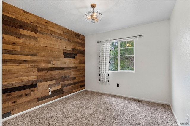 7171 Canyon Way, Frederick, CO 80504 - carpeted spare room featuring wooden walls and a chandelier