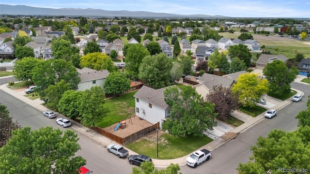 7171 Canyon Way, Frederick, CO 80504 - aerial view of residential area with a mountain backdrop