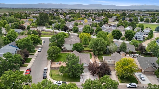 7171 Canyon Way, Frederick, CO 80504 - aerial perspective of suburban area with mountains