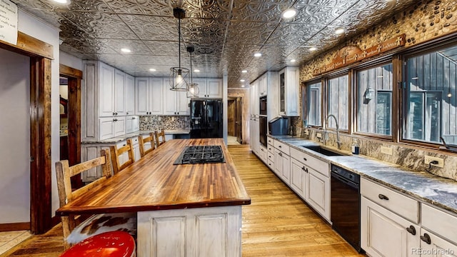 1300 N State Highway 149, Lake City, CO 81235 - kitchen featuring black appliances, an ornate ceiling, wood counters, decorative backsplash, and white cabinets