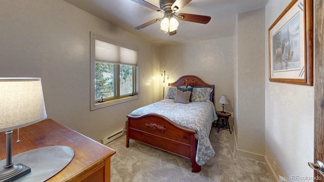 1300 N State Highway 149, Lake City, CO 81235 - bedroom featuring baseboard heating, light colored carpet, and a ceiling fan