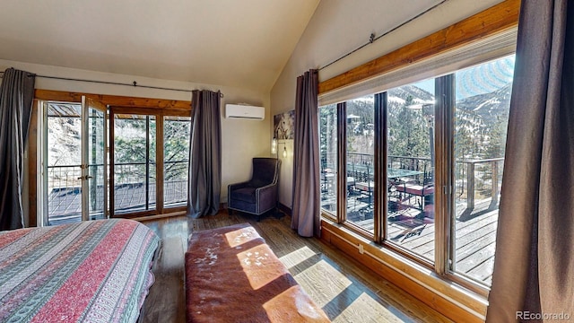 1300 N State Highway 149, Lake City, CO 81235 - bedroom featuring lofted ceiling, wood finished floors, and a wall unit AC