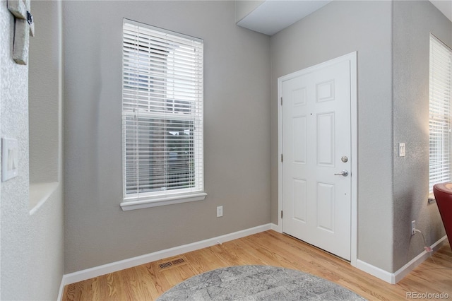 24686 E Florida Ave, Aurora, CO 80018 - entryway with light wood finished floors and baseboards