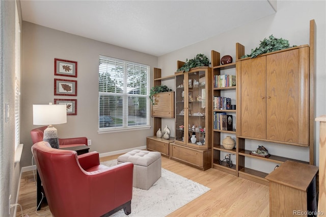 24686 E Florida Ave, Aurora, CO 80018 - sitting room featuring light wood-style floors and baseboards
