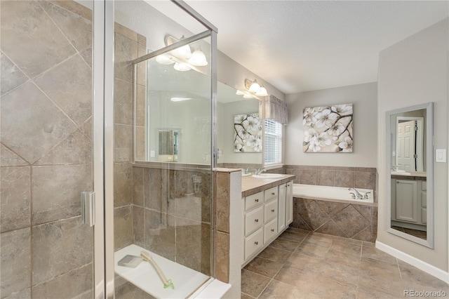 24686 E Florida Ave, Aurora, CO 80018 - full bathroom with vanity, a bath, and a stall shower
