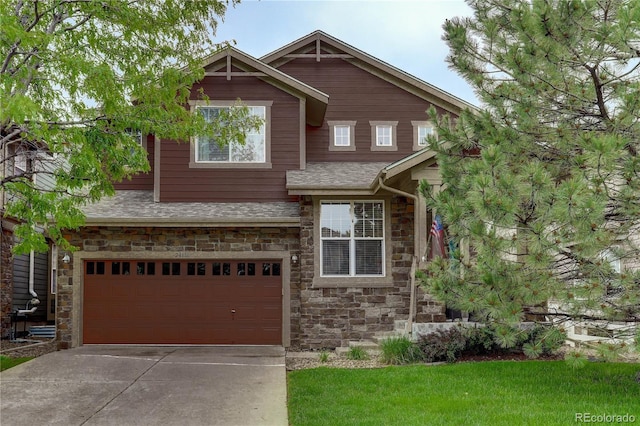 24686 E Florida Ave, Aurora, CO 80018 - view of front of house with an attached garage, stone siding, roof with shingles, and concrete driveway