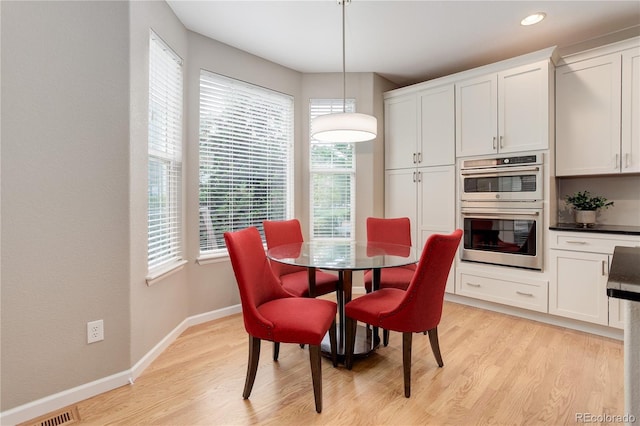 24686 E Florida Ave, Aurora, CO 80018 - dining area featuring light wood-style flooring, baseboards, and recessed lighting