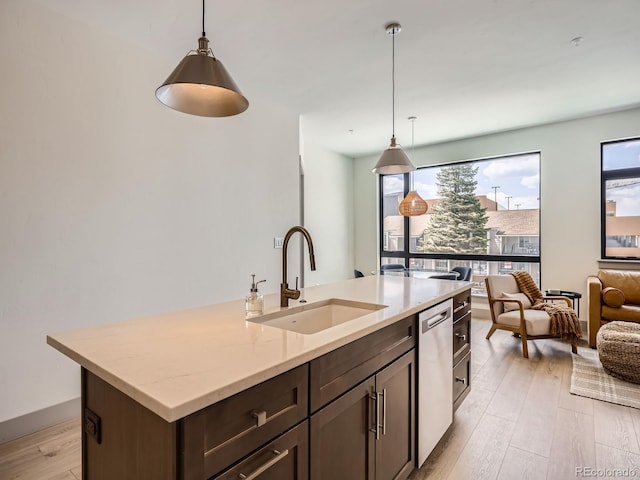 75 W 4th St Unit 205W, Silverthorne, CO 80498 - kitchen with dishwasher, healthy amount of natural light, light wood finished floors, and dark brown cabinets