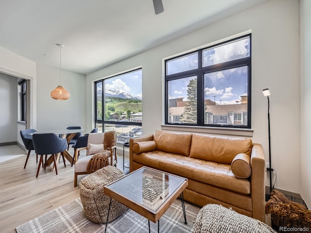 75 W 4th St Unit 205W, Silverthorne, CO 80498 - living room with light wood-type flooring and ceiling fan