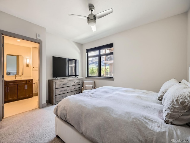 75 W 4th St Unit 205W, Silverthorne, CO 80498 - bedroom with light colored carpet, connected bathroom, and a ceiling fan