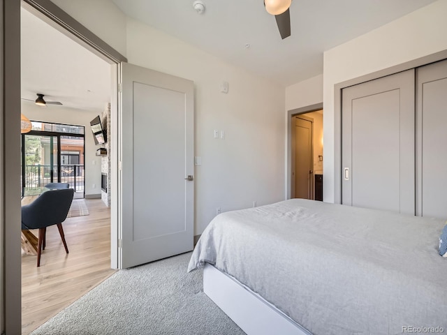 75 W 4th St Unit 205W, Silverthorne, CO 80498 - bedroom with light wood finished floors, ceiling fan, and a closet
