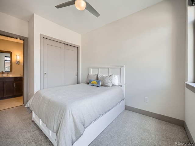 75 W 4th St Unit 205W, Silverthorne, CO 80498 - bedroom with light colored carpet, a closet, a ceiling fan, and connected bathroom