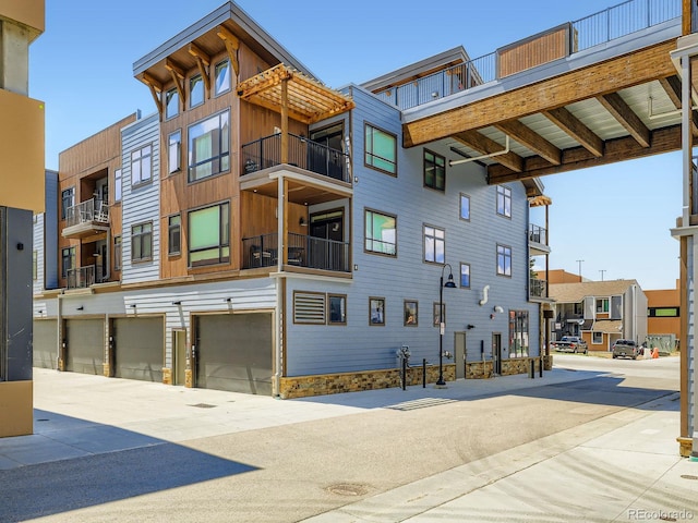 75 W 4th St Unit 205W, Silverthorne, CO 80498 - view of building exterior featuring a garage and a residential view