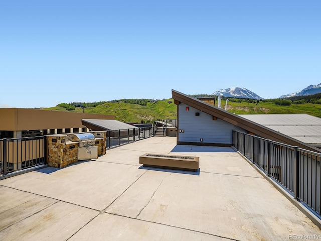 75 W 4th St Unit 205W, Silverthorne, CO 80498 - view of patio featuring a mountain view and exterior kitchen