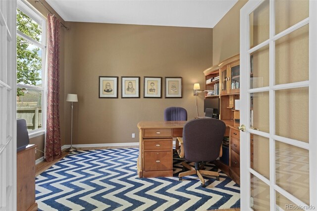 office area featuring baseboards and french doors