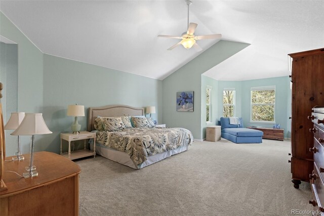 bedroom featuring vaulted ceiling, carpet flooring, and a ceiling fan