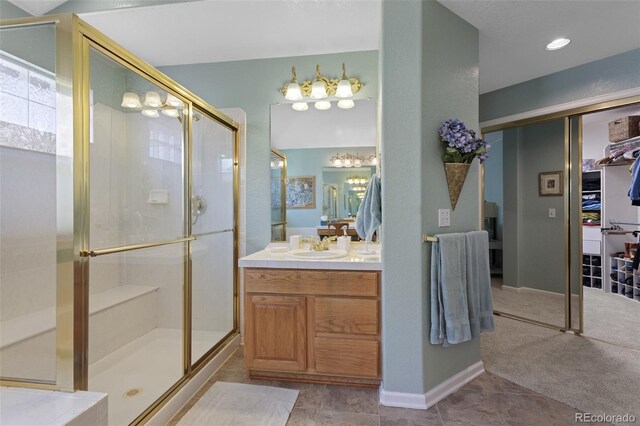 full bathroom featuring a shower stall and vanity