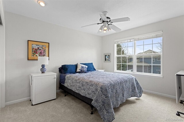 bedroom featuring carpet, baseboards, and ceiling fan