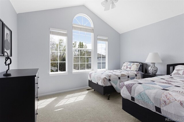 bedroom featuring vaulted ceiling, carpet floors, baseboards, and ceiling fan