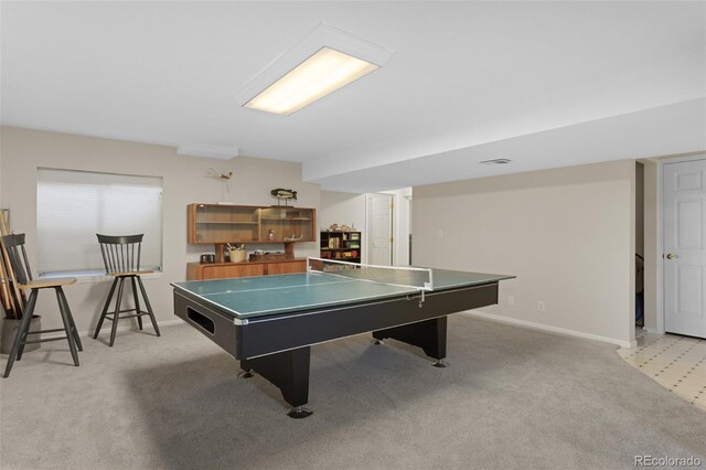 game room featuring light colored carpet and baseboards