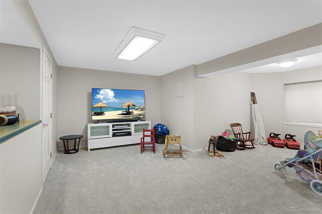 rec room featuring carpet floors and baseboards