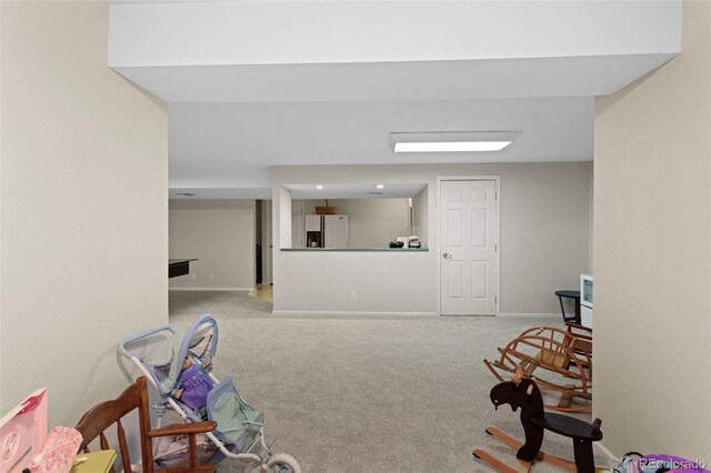 playroom featuring carpet and baseboards
