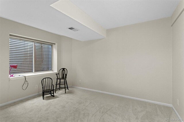 sitting room with carpet and baseboards