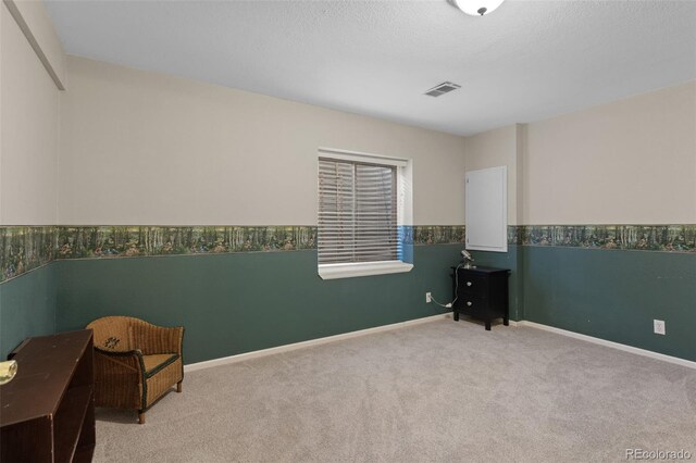 carpeted spare room with baseboards