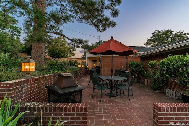 view of patio terrace at dusk