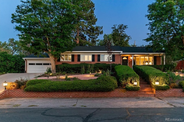 ranch-style house featuring a garage