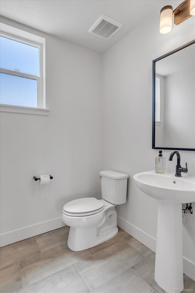 2108 Alcott Way, Broomfield, CO 80023 - bathroom with toilet and baseboards