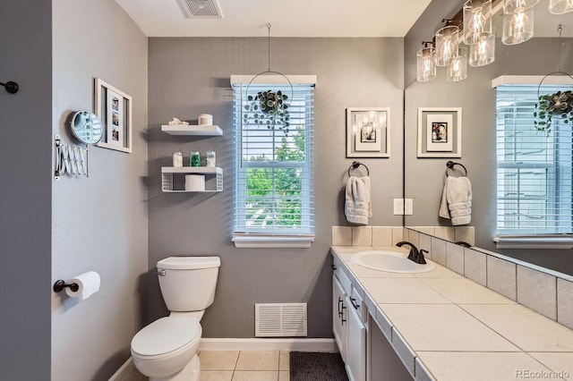 1539 Bennet Mountain Rd, Castle Rock, CO 80109 - bathroom with toilet, vanity, tile patterned floors, and baseboards